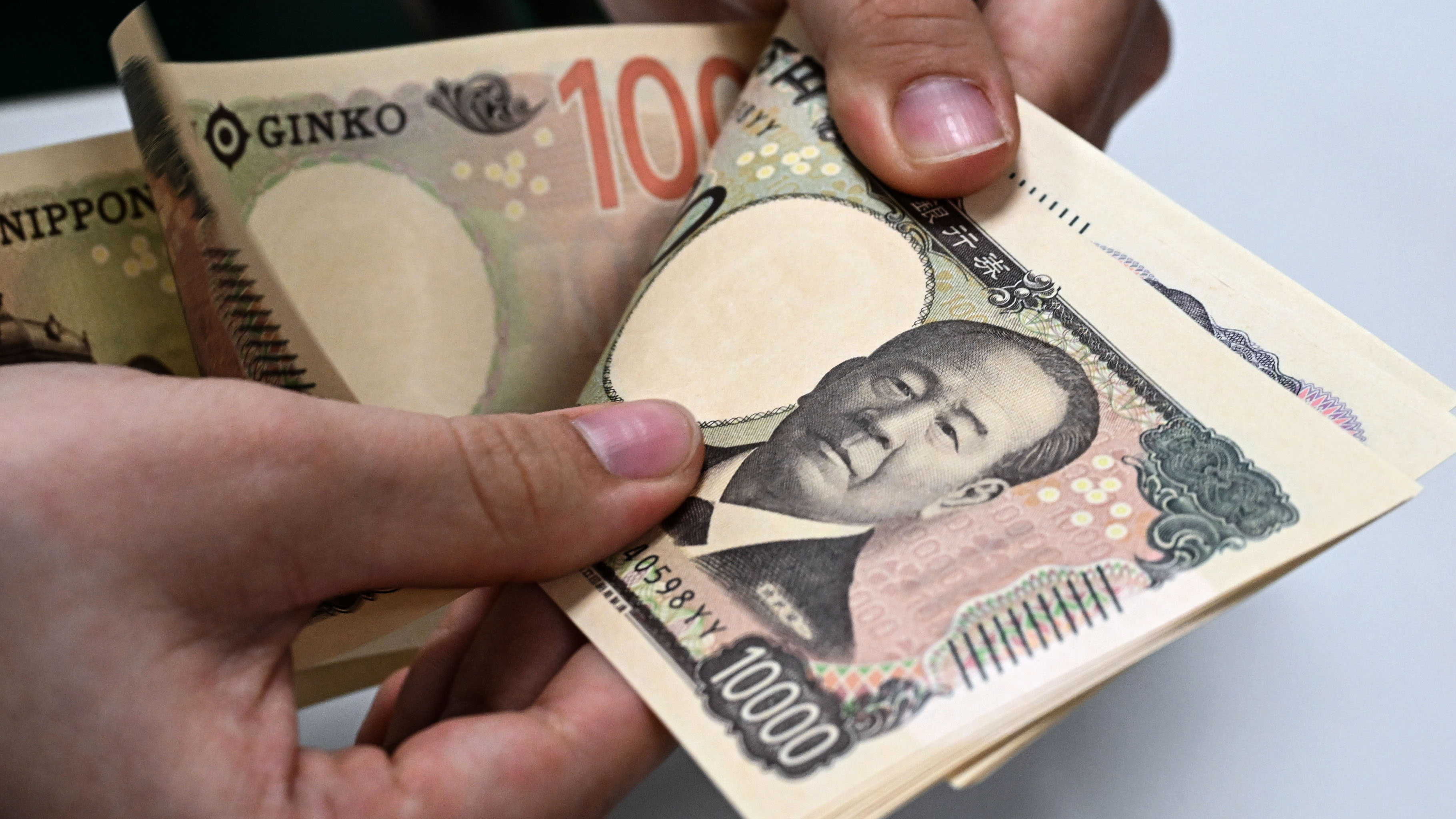 Japan corporate profits up 10% on weak yen, AI demand - Nikkei Asia