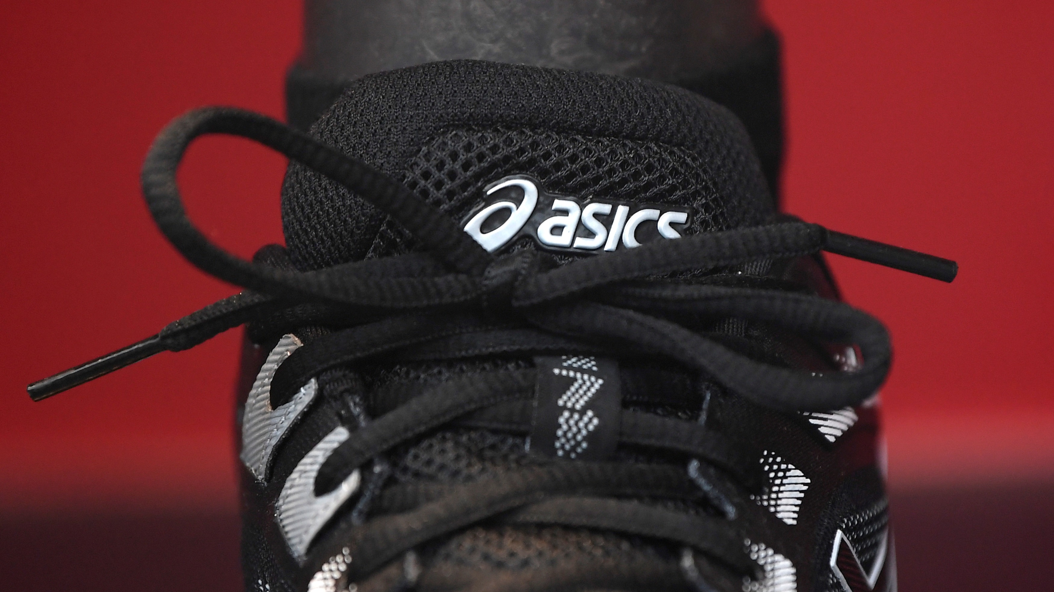 ASICS puts investor relations to test with sports charity plan
