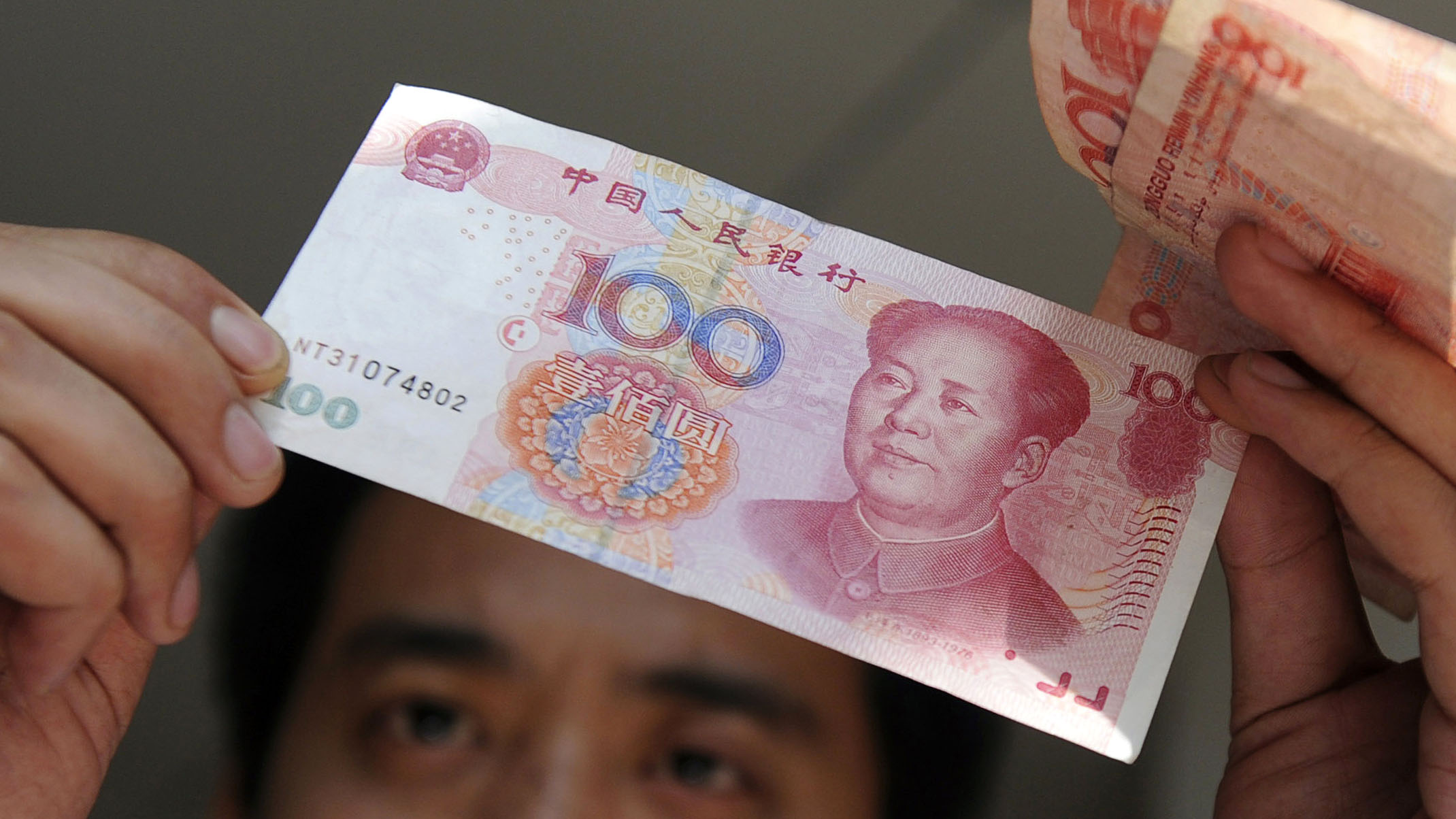Hong Kong-listed companies slash dollar borrowings in favor of yuan -  Nikkei Asia