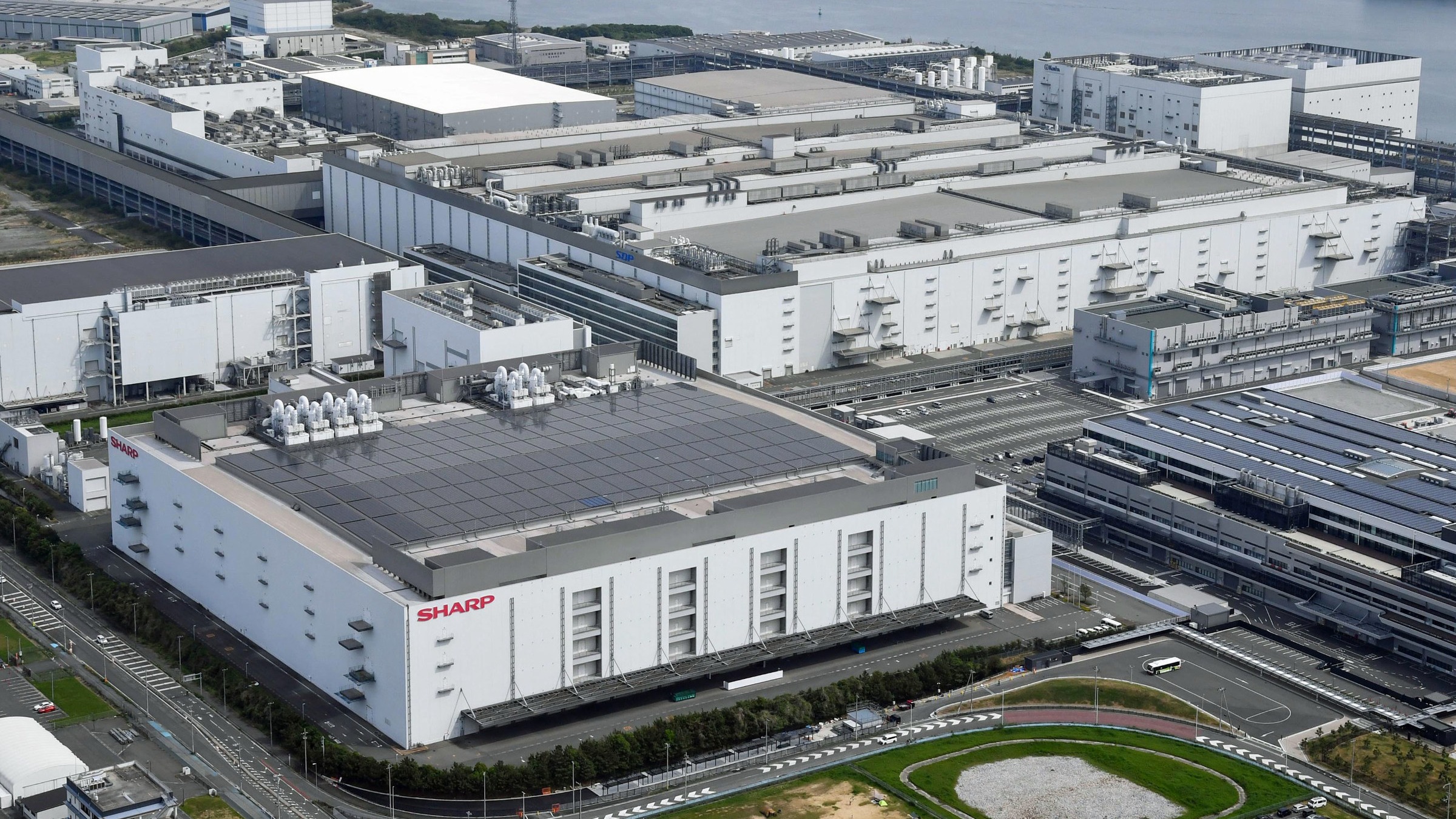 Sharp, KDDI to turn old factory into Nvidia-powered AI data center ...
